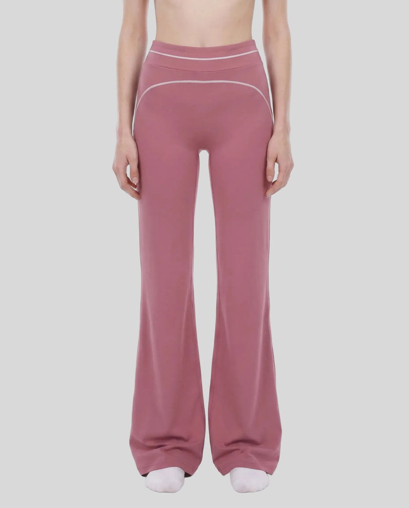 Model wearing the TrackLine Outline Flared Pants in Purple viewed from the front