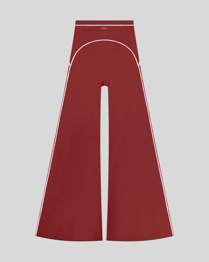TrackLine Outline Flared Pants in Red front view featuring a high-rise waistband, contrast piping, and flared leg