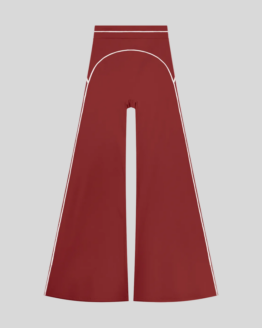 TrackLine Outline Flared Pants in Red front view featuring a high-rise waistband, contrast piping, and flared leg