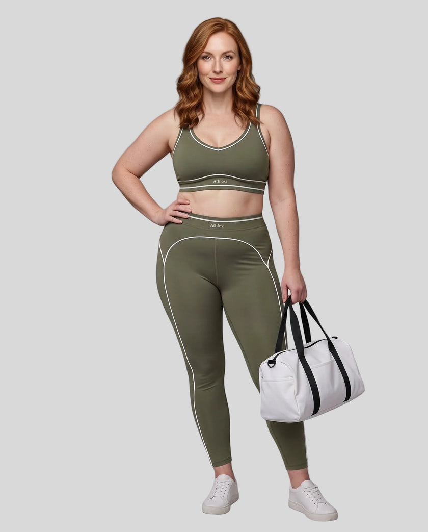 Front angled full body view of a model wearing the TrackLine Outline Leggings in Gray Green