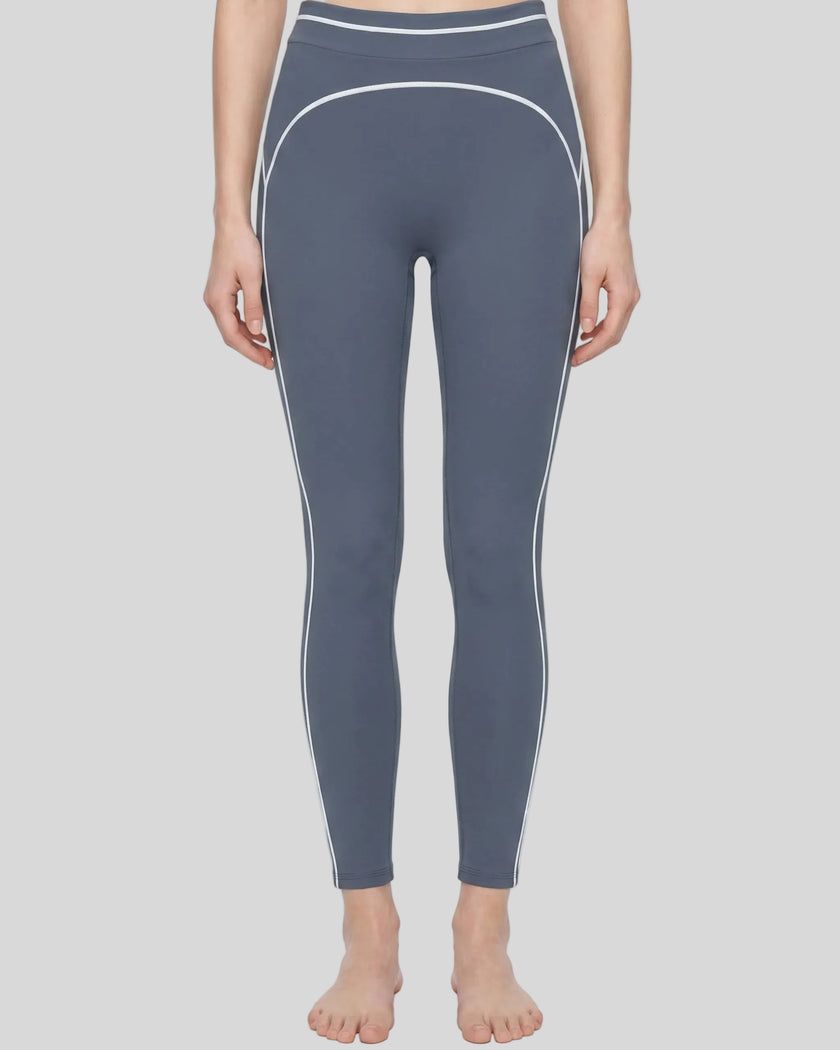 Model wearing the TrackLine Outline Leggings in Haze Blue viewed from the front