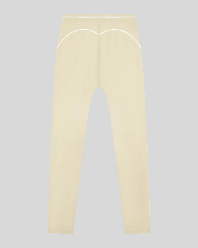 TrackLine Outline Flared Pants in Light Apricot back view showcasing the sculpting back seam
