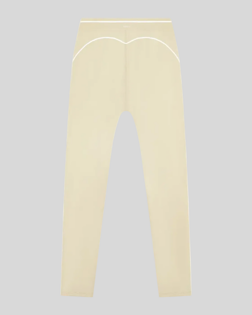 TrackLine Outline Leggings in Light Apricot back view showcasing the sculpting back seam and contrast piping
