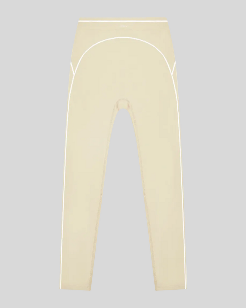 TrackLine Outline Leggings in Light Apricot front view featuring a high-rise waistband and contrast piping