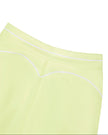 Close-up of the back waistband and contour seam on the TrackLine Outline Leggings in Light Green