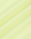 Close-up of the smooth stretch performance fabric used on the TrackLine Outline Leggings in Light Green