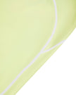 Side close-up of the TrackLine Outline Leggings in Light Green highlighting the contrast piping detail