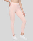 Front angled view of a model wearing the TrackLine Outline Leggings in Light Pink