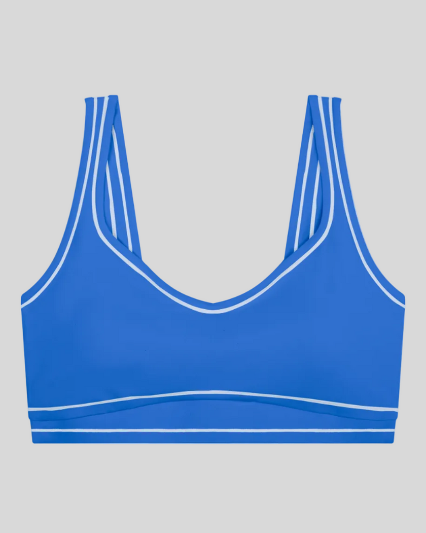 TrackLine Outline Sports Bra in Colorful Blue front view featuring contrast piping and a supportive fit
