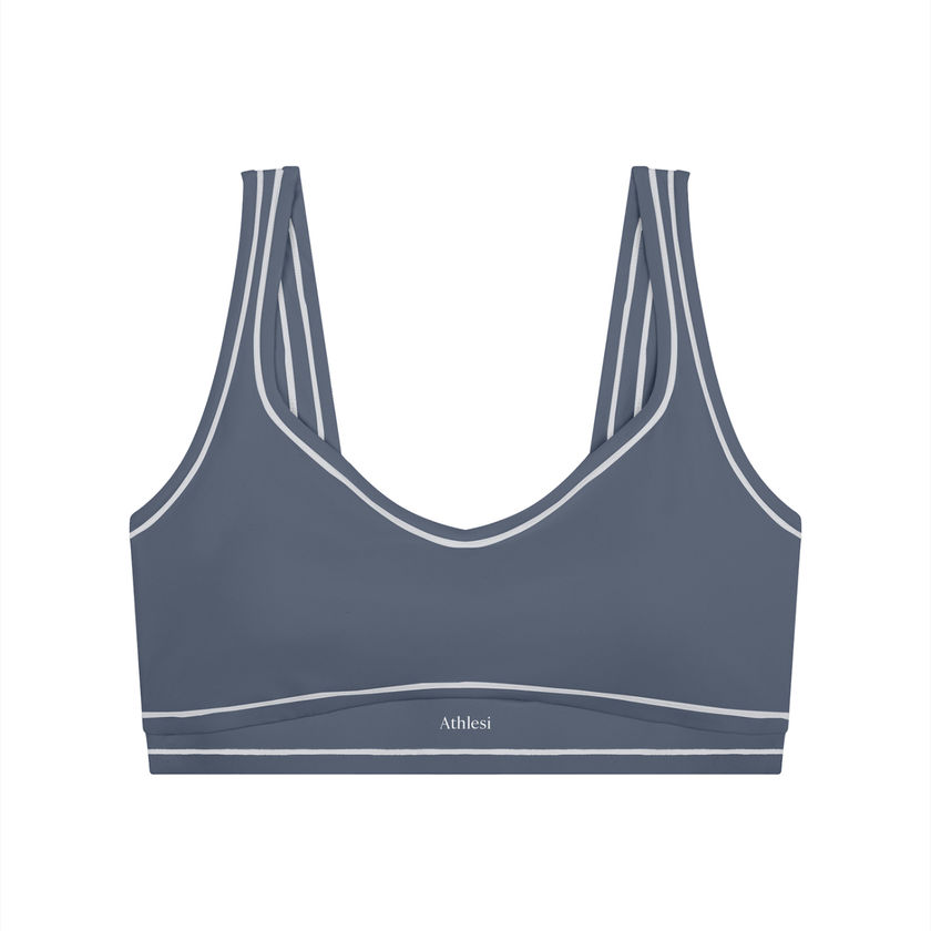 TrackLine Outline Sports Bra in Haze Blue front view featuring contrast piping and a supportive fit