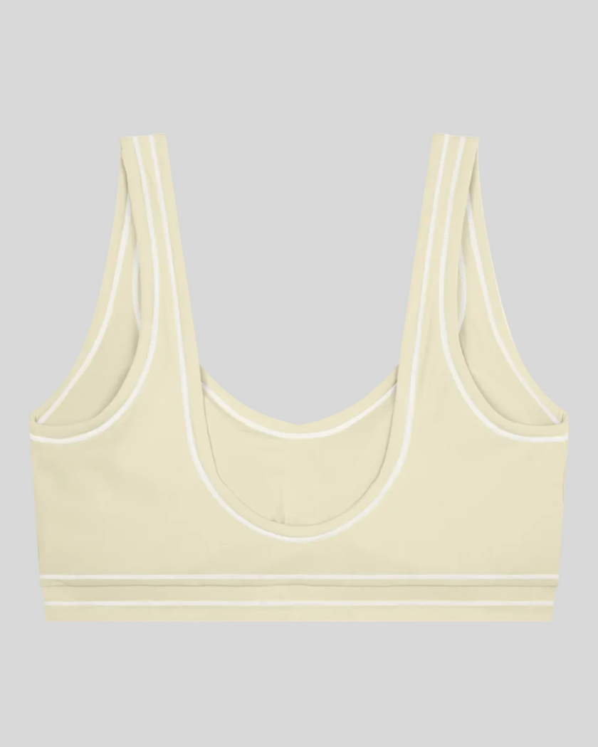 TrackLine Outline Sports Bra in Light Apricot back view showcasing the open scoop back design
