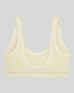 TrackLine Outline Sports Bra in Light Apricot back view showcasing the open scoop back design