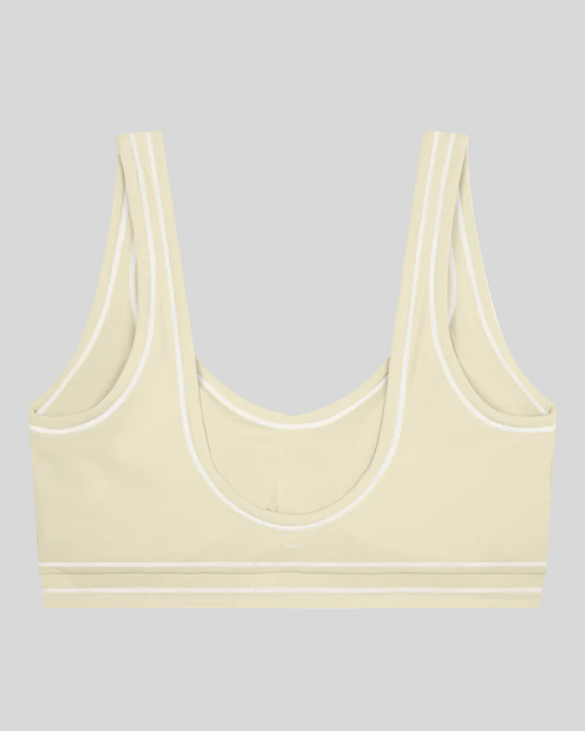 TrackLine Outline Sports Bra in Light Apricot back view showcasing the open scoop back design