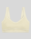 TrackLine Outline Sports Bra in Light Apricot front view featuring contrast piping and a supportive fit