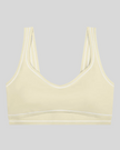 TrackLine Outline Sports Bra in Light Apricot front view featuring contrast piping and a supportive fit