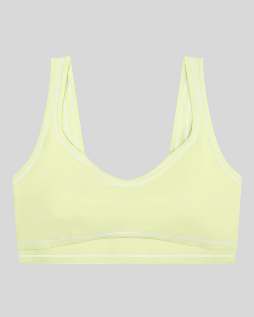 TrackLine Outline Sports Bra in Light Green front view featuring contrast piping and a supportive fit