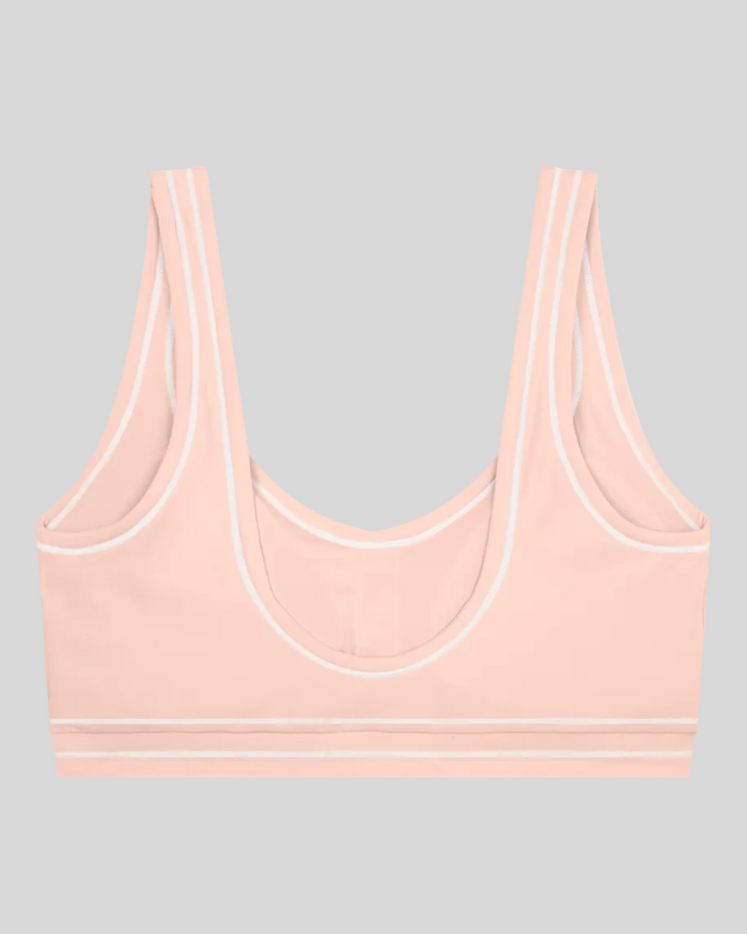TrackLine Outline Sports Bra in Light Pink back view showcasing the open scoop back design