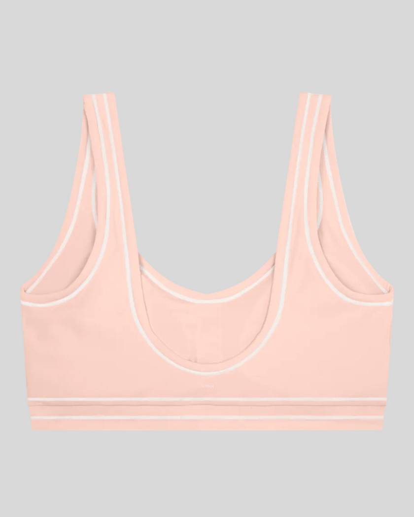 TrackLine Outline Sports Bra in Light Pink back view showcasing the open scoop back design