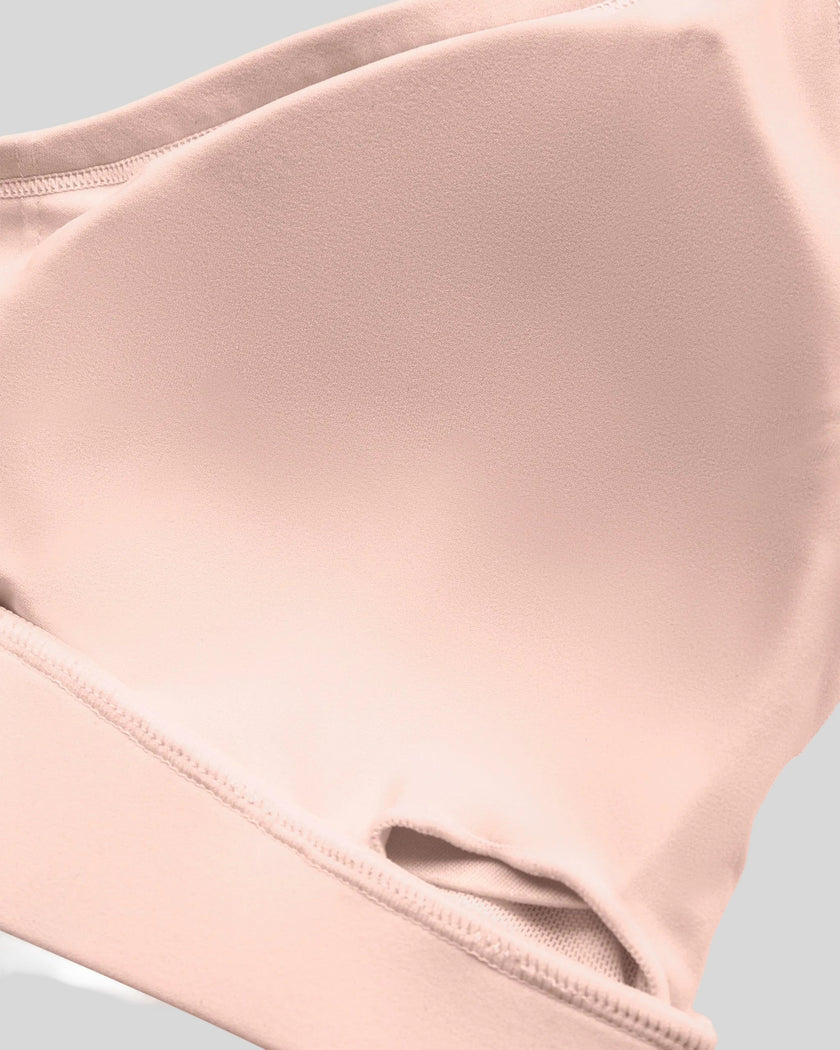 Interior removable chest padding detail of the TrackLine Outline Sports Bra in Light Pink