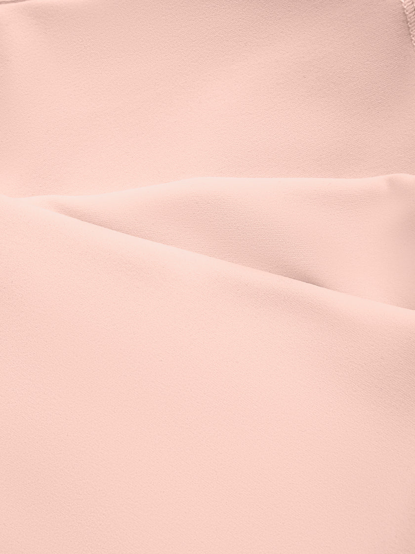 Close-up of the smooth stretch performance fabric used on the TrackLine Outline Sports Bra in Light Pink