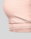 Close-up of the supportive elastic underband on the TrackLine Outline Sports Bra in Light Pink