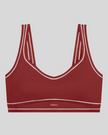 TrackLine Outline Sports Bra in Red front view featuring contrast piping and a supportive fit
