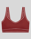 TrackLine Outline Sports Bra in Red front view featuring contrast piping and a supportive fit