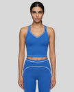 Model wearing the TrackLine Outline Tank Top in Colorful Blue viewed from the front