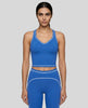 Model wearing the TrackLine Outline Tank Top in Colorful Blue viewed from the front