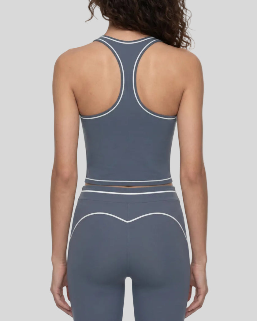 Back view of a model wearing the TrackLine Outline Tank Top in Haze Blue