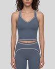 Model wearing the TrackLine Outline Tank Top in Haze Blue viewed from the front