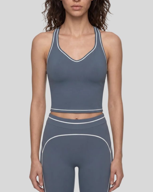 Model wearing the TrackLine Outline Tank Top in Haze Blue viewed from the front