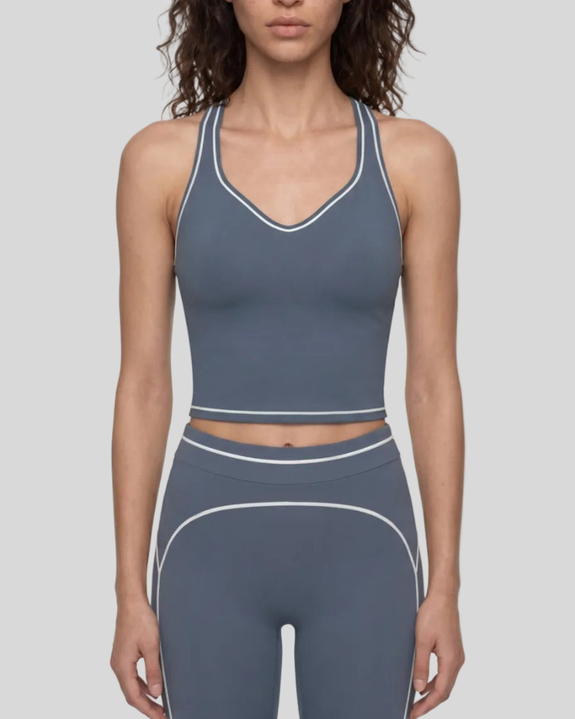 Model wearing the TrackLine Outline Tank Top in Haze Blue viewed from the front