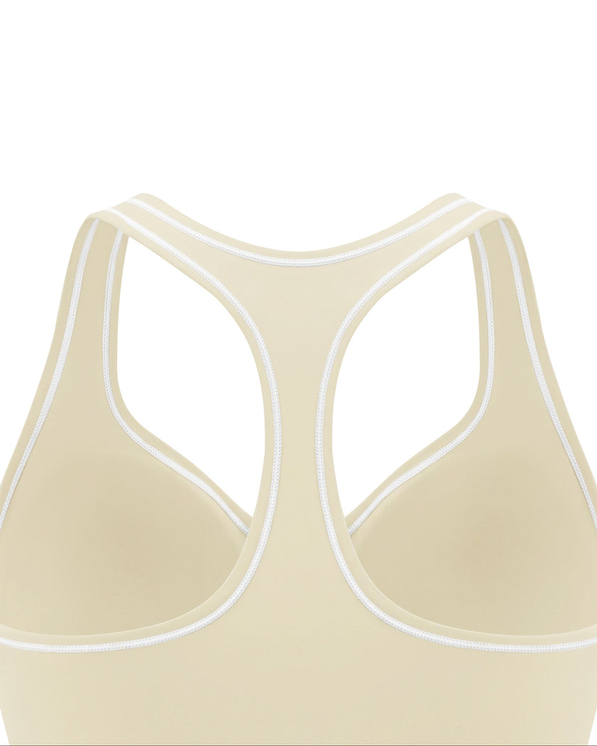 Close-up of the racerback and contrast piping on the TrackLine Outline Tank Top in Light Apricot