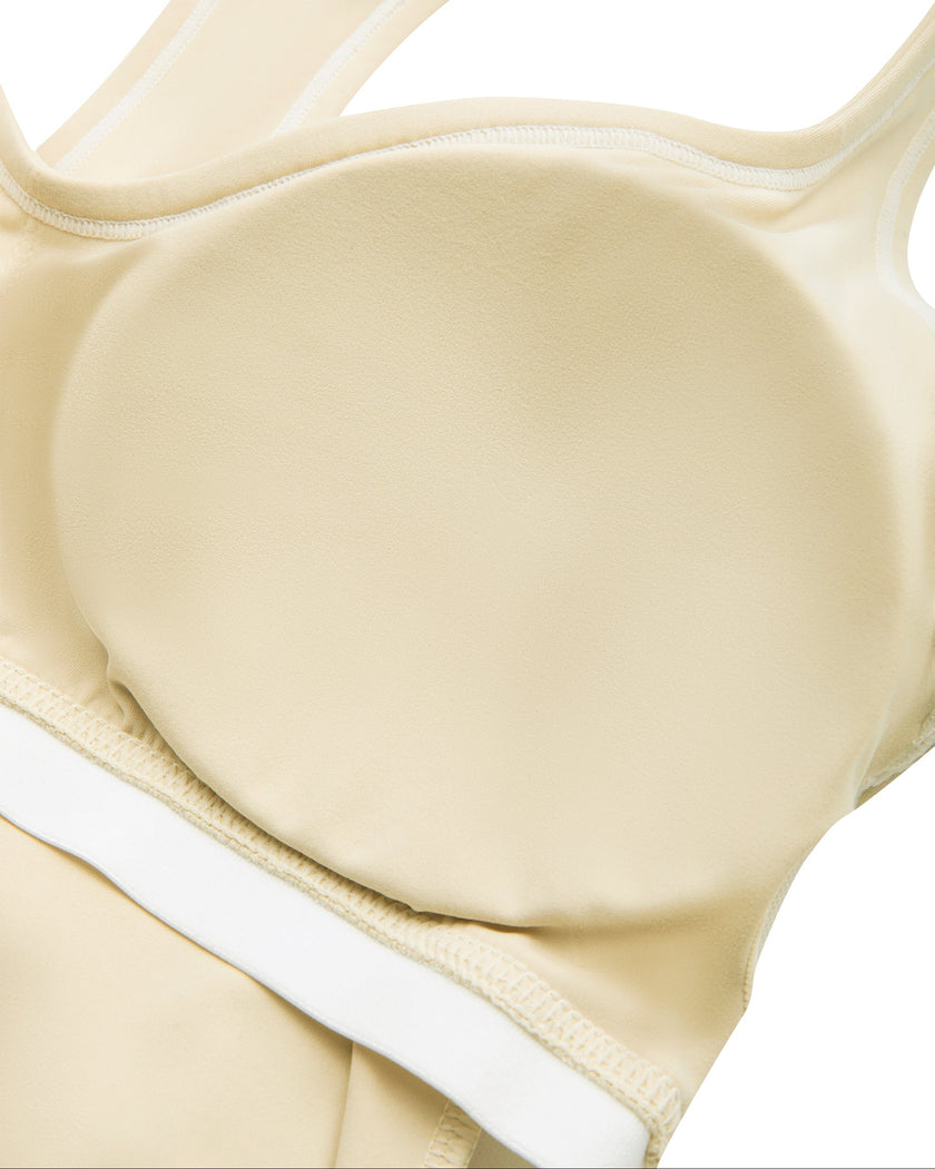 Interior removable chest padding detail of the TrackLine Outline Tank Top in Light Apricot
