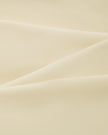 Close-up of the smooth stretch performance fabric used on the TrackLine Outline Tank Top in Light Apricot