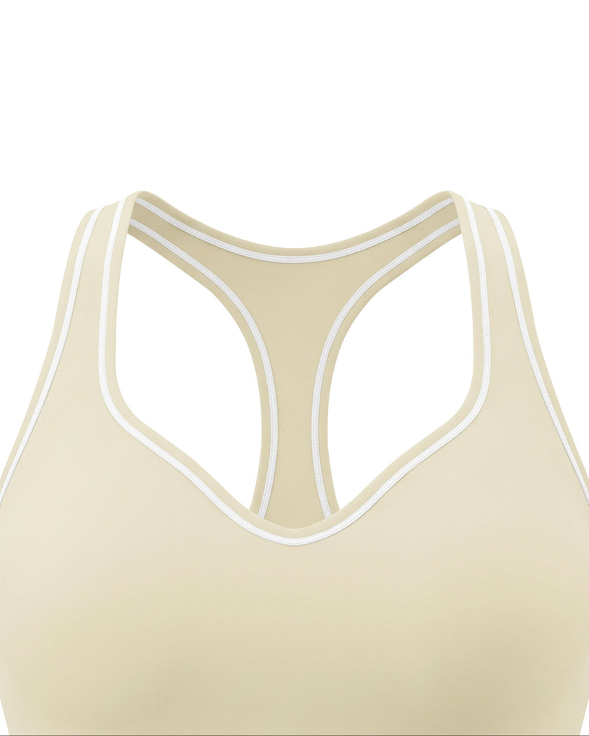 Close-up of the neckline and contrast piping on the TrackLine Outline Tank Top in Light Apricot