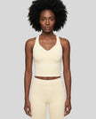 Model wearing the TrackLine Outline Tank Top in Light Apricot viewed from the front