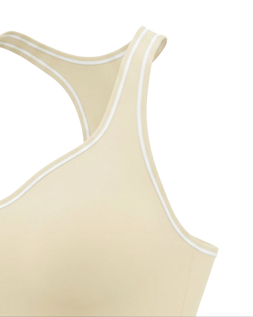 Side angle close-up of the TrackLine Outline Tank Top in Light Apricot highlighting its fitted silhouette