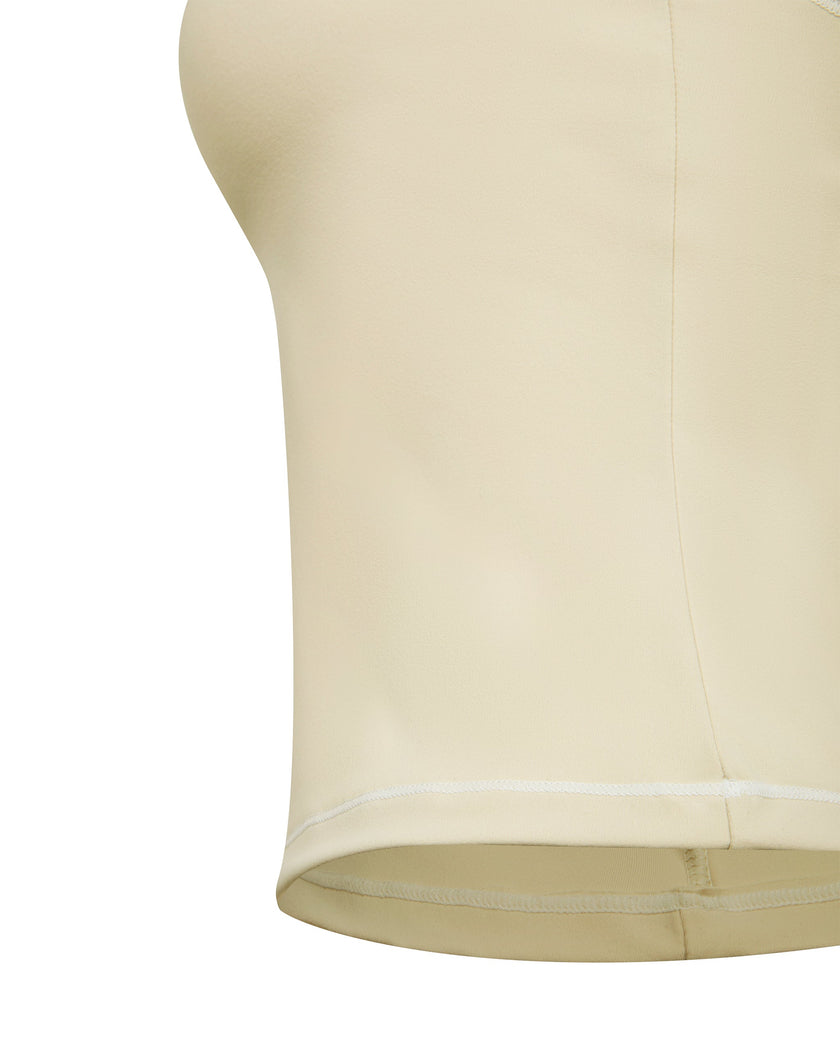 Close-up of the supportive underbust band and hem on the TrackLine Outline Tank Top in Light Apricot