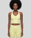 Model wearing the TrackLine Outline Tank Top in Light Green viewed from the front