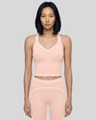 Model wearing the TrackLine Outline Tank Top in Light Pink viewed from the front