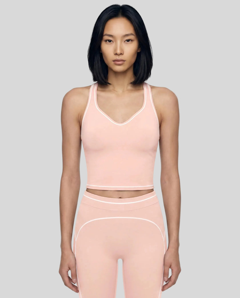 Model wearing the TrackLine Outline Tank Top in Light Pink viewed from the front