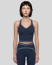 Model wearing the TrackLine Outline Tank Top in Navy Blue viewed from the front