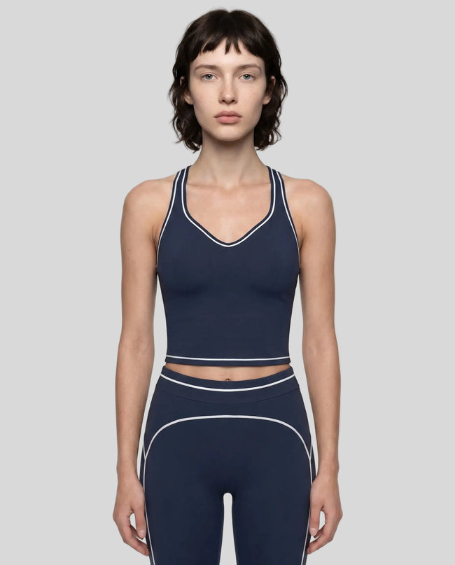 Model wearing the TrackLine Outline Tank Top in Navy Blue viewed from the front