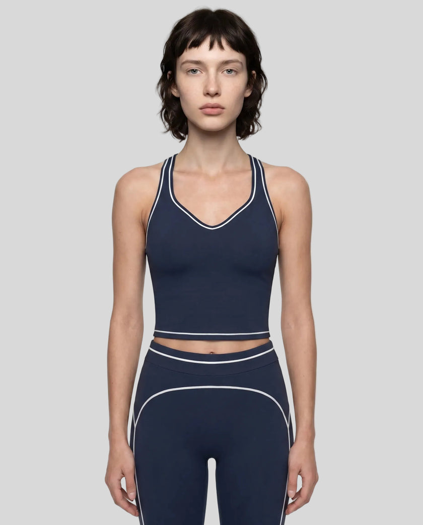 Model wearing the TrackLine Outline Tank Top in Navy Blue viewed from the front