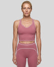Model wearing the TrackLine Outline Tank Top in Purple viewed from the front