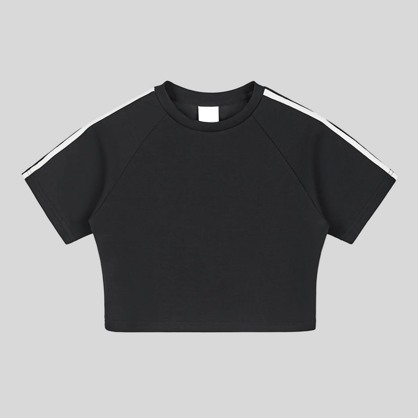 Athlesi TrackLine Performance Crop Tee in black with contrast shoulder taping shown in flatlay front view