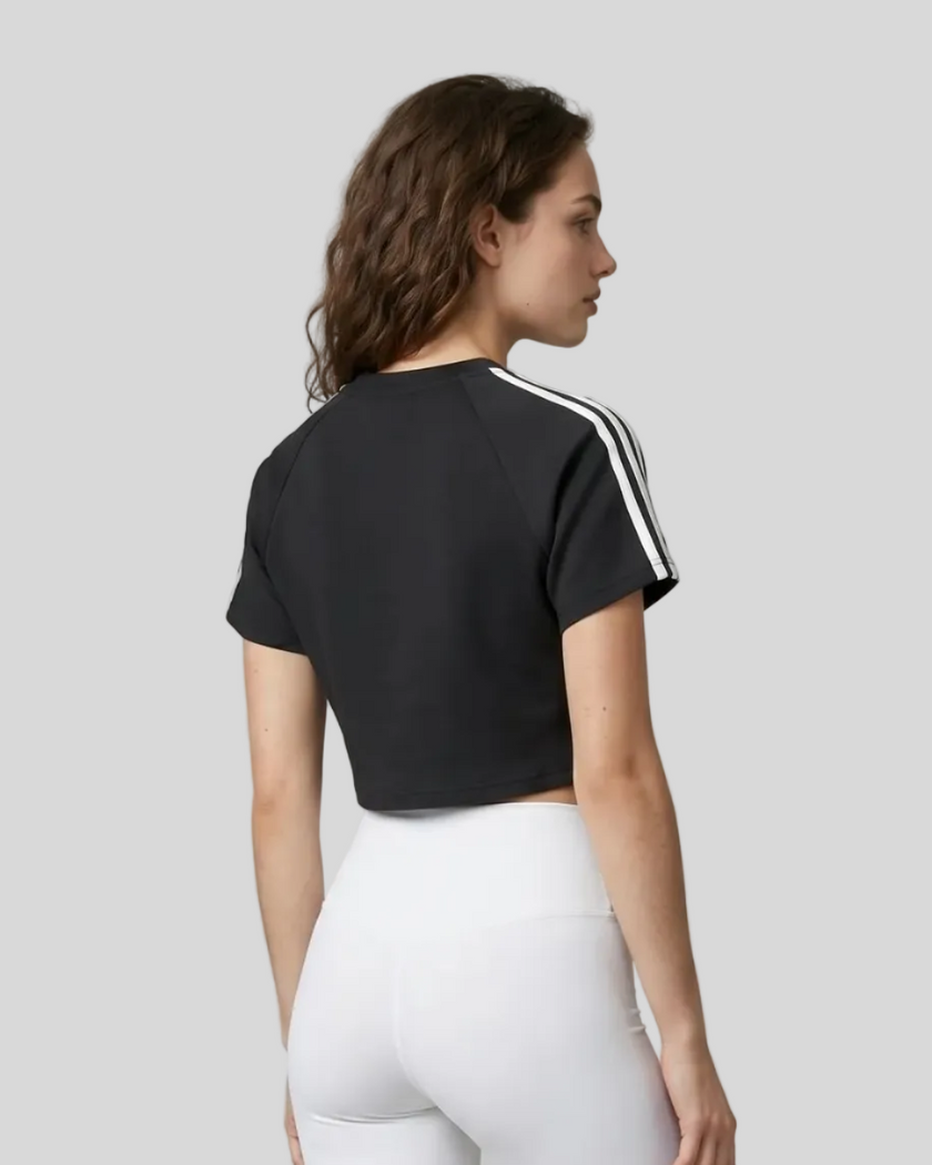 Upper body back view of the Athlesi TrackLine Performance Crop Tee in black