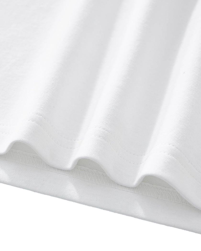 Bottom hem closeup of the Athlesi TrackLine Performance Crop Tee in white